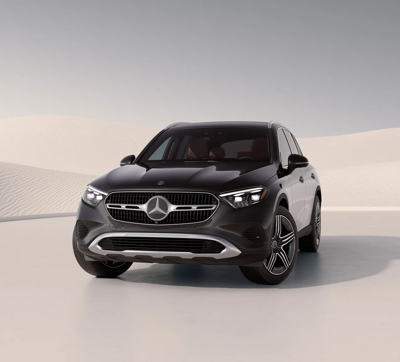 Front view of the 2026 Mercedes-Benz GLC luxury SUV in black, showcasing its modern grille design and aerodynamic body.