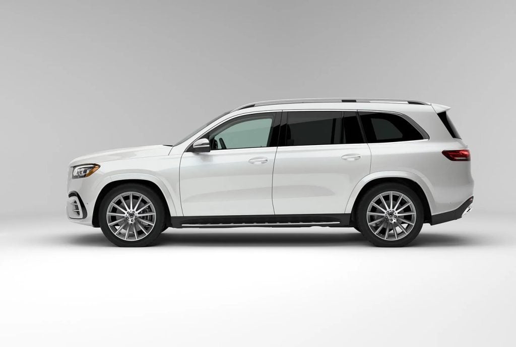 Side view of a Mercedes-Benz family vehicle highlighting warranty coverage and family-friendly design