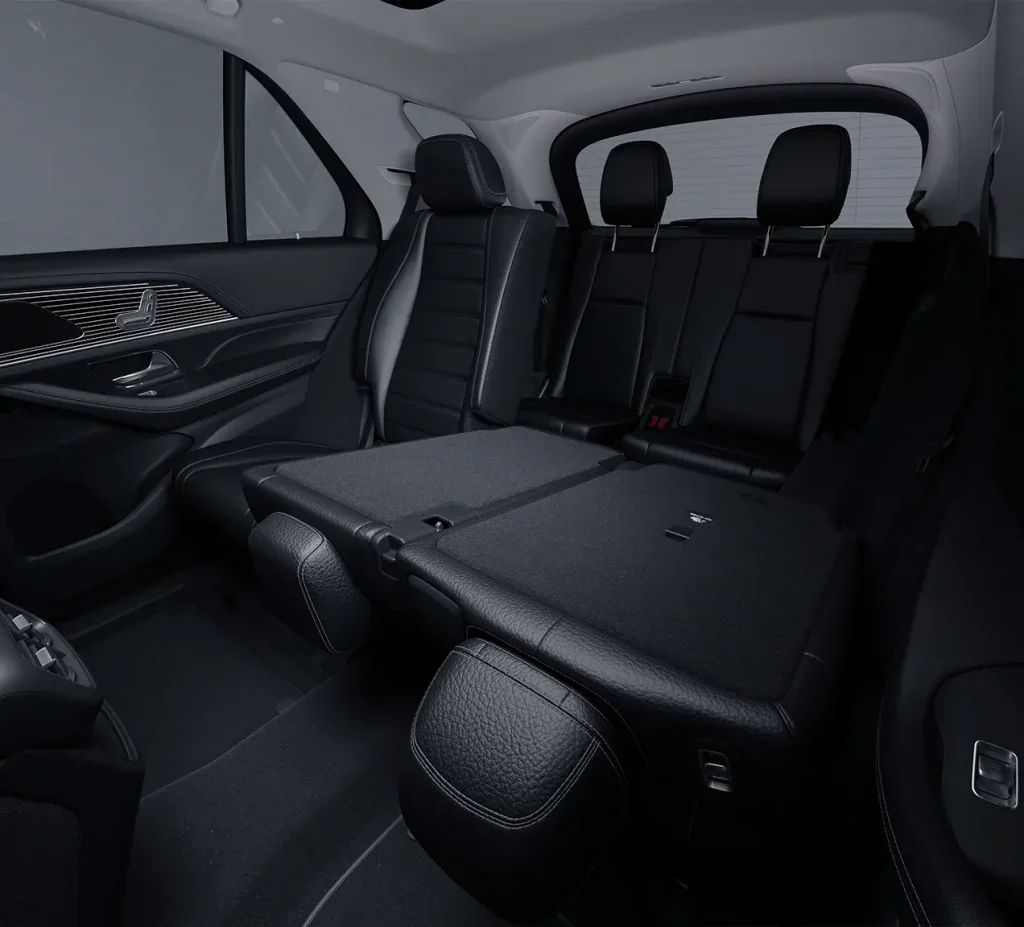 Interior view of the 2026 Mercedes-Benz GLE with rear seats folded flat, showing expanded cargo room for holiday gifts, luggage, or family travel gear.