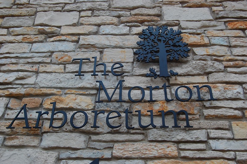 The Morton Arboretum sign at an outdoor date destination near Chicago.