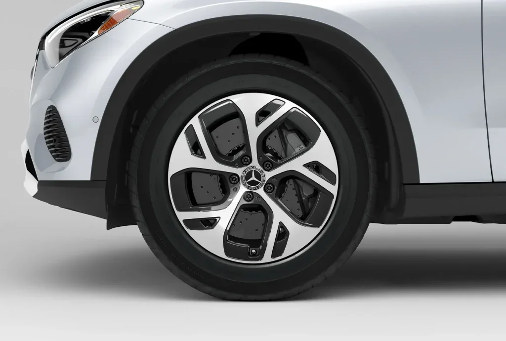 Close-up of a Mercedes-Benz winter tire inspection for safe driving in Chicago winter conditions.