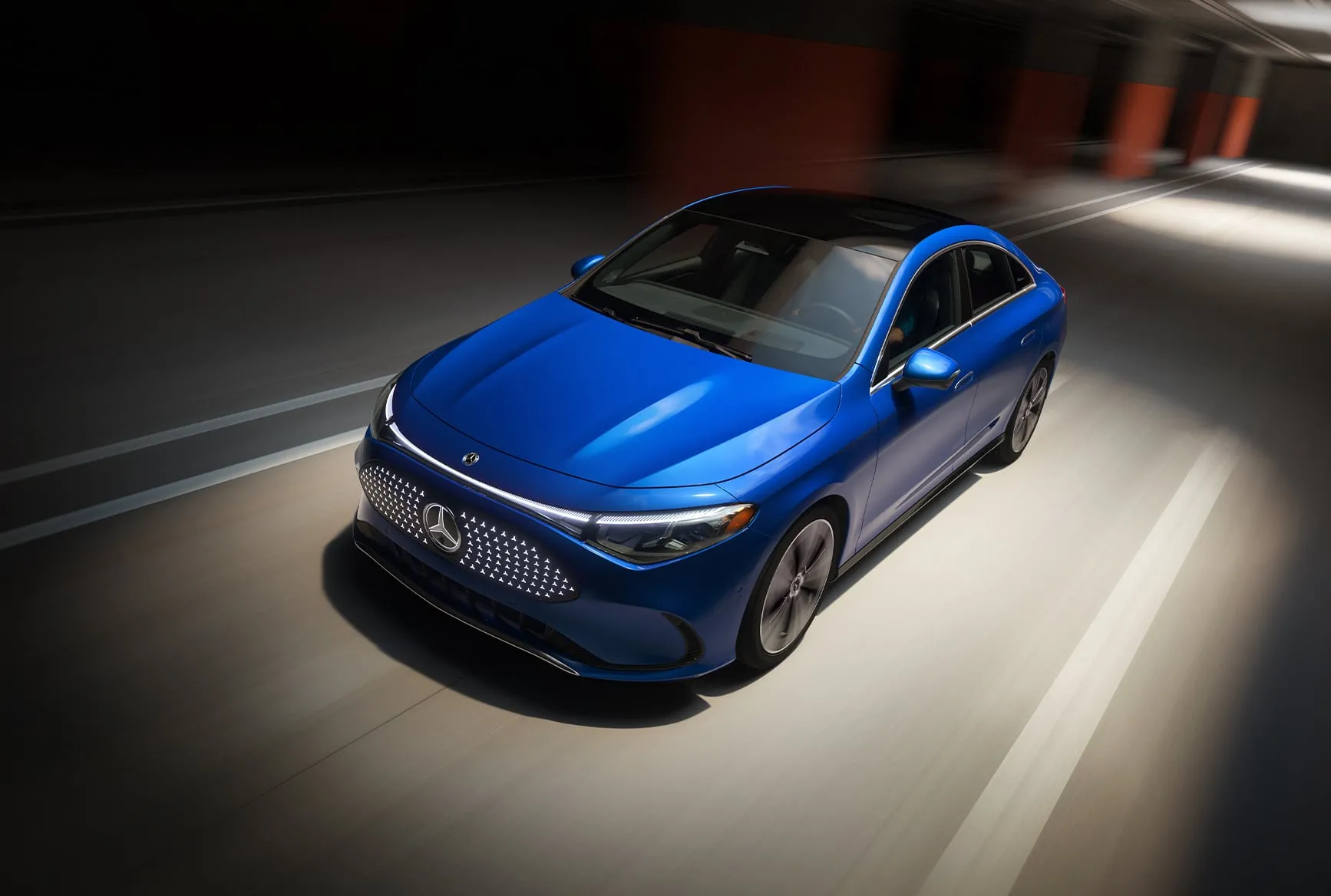 Blue new Mercedes-Benz CLA Electric driving through a tunnel, previewing the EV coming soon for Chicago drivers.