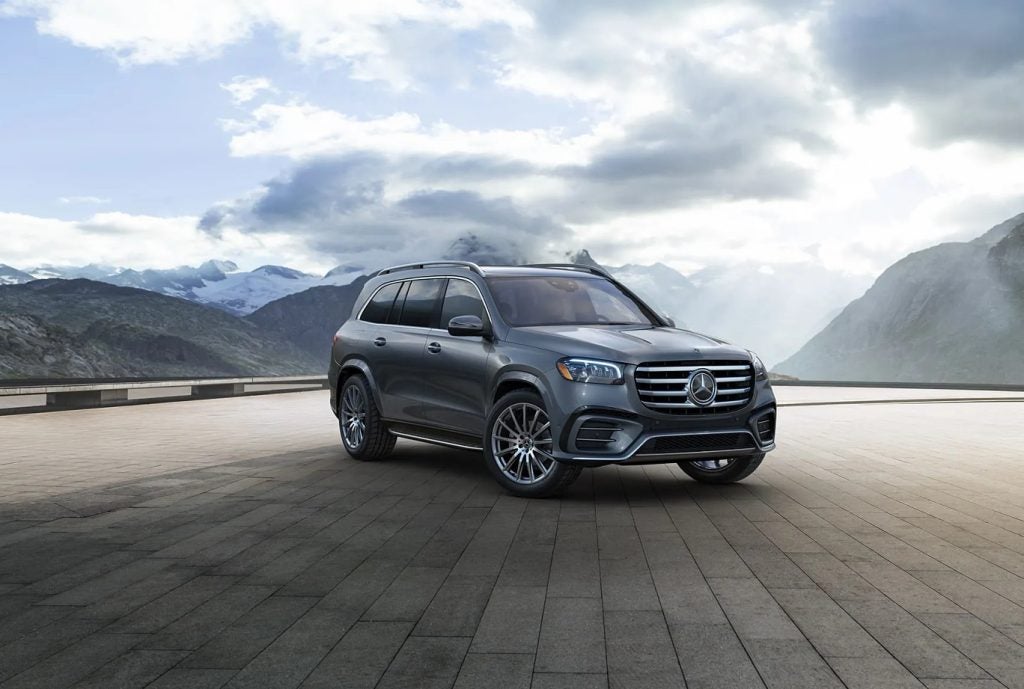 Mercedes-Benz family vehicle on a scenic road representing warranty protection for family travel