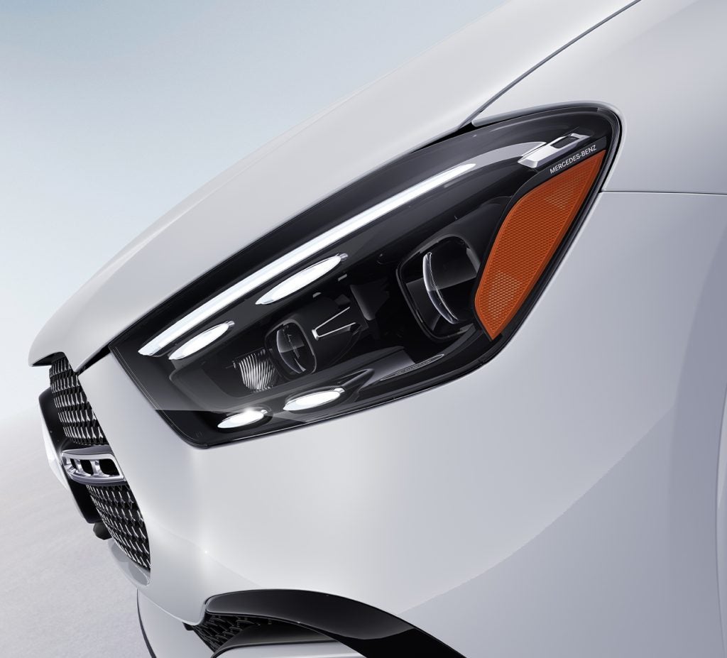 Close-up of the 2026 Mercedes-Benz GLE headlight, highlighting its modern LED design and precision detailing for enhanced visibility and style.