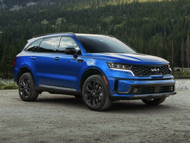A blue Kia Sorento parked outside