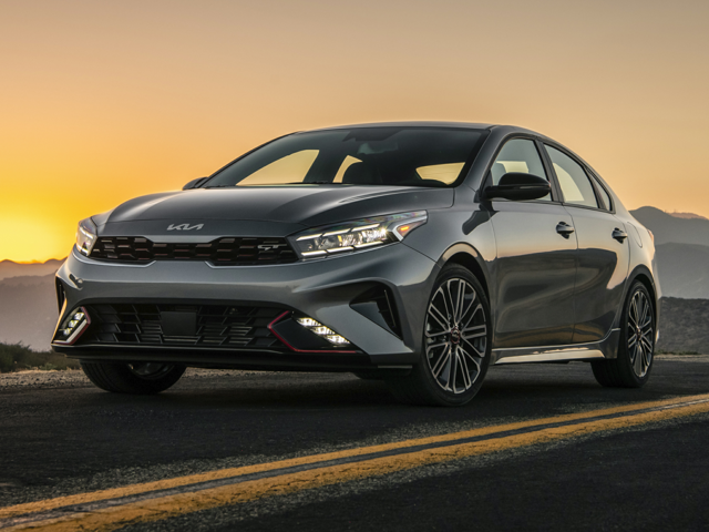A Kia Forte driving on the road