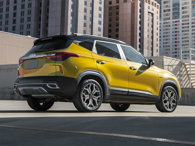 A Yellow Kia Seltos parked outside