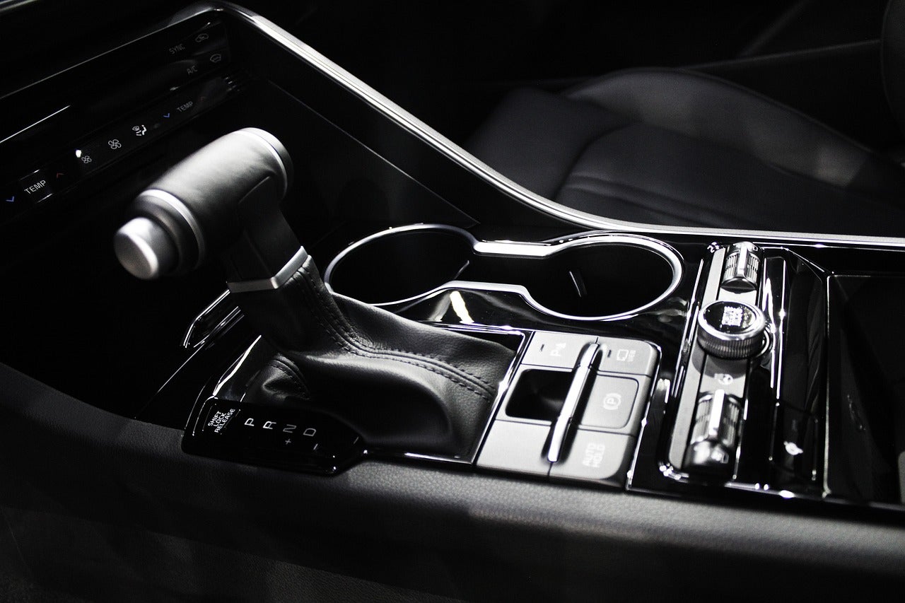 A black and white gear shift in a car