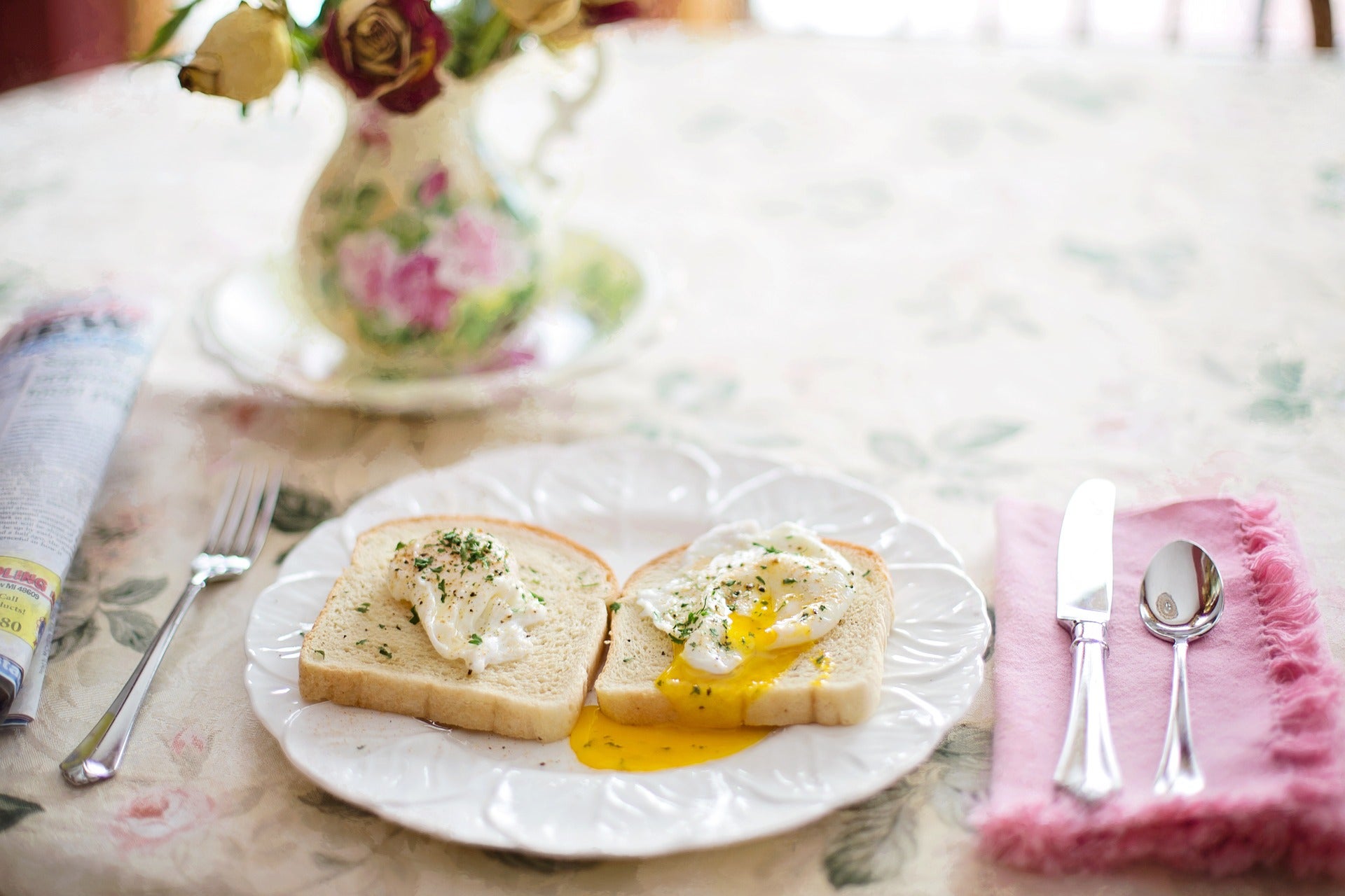 Two pieces of toast with eggs on a plate
