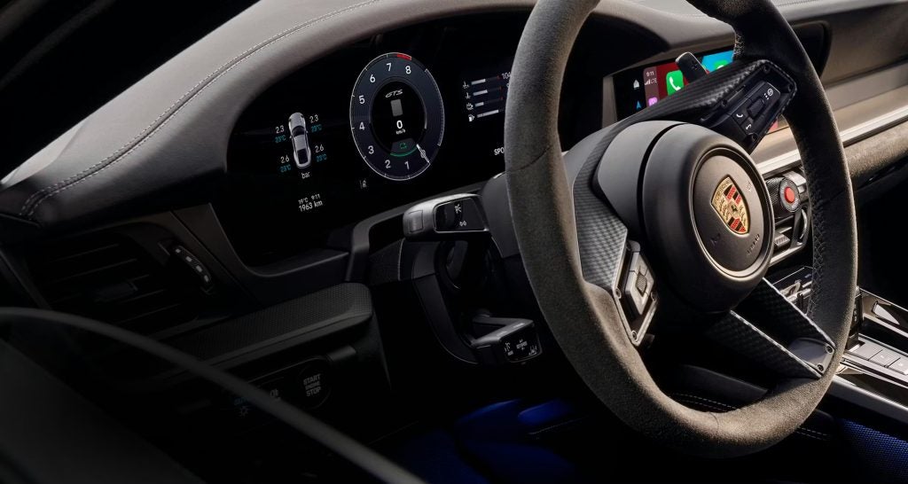 Interior driving view of the 2026 Porsche 911 showing why experienced drivers buy it when they’re ready