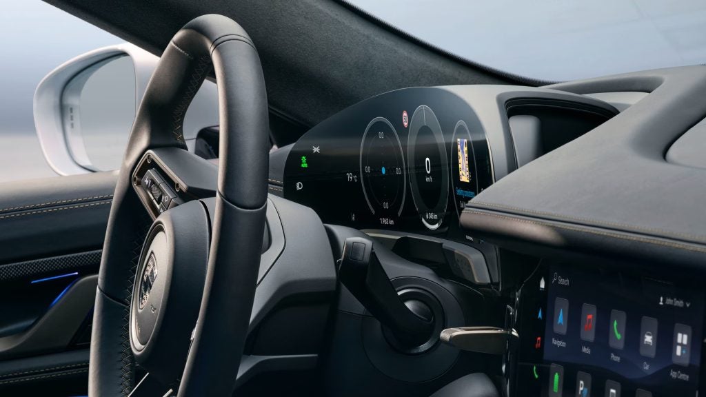 2026 Porsche Taycan EV interior with premium materials, digital cockpit, and luxury electric car design