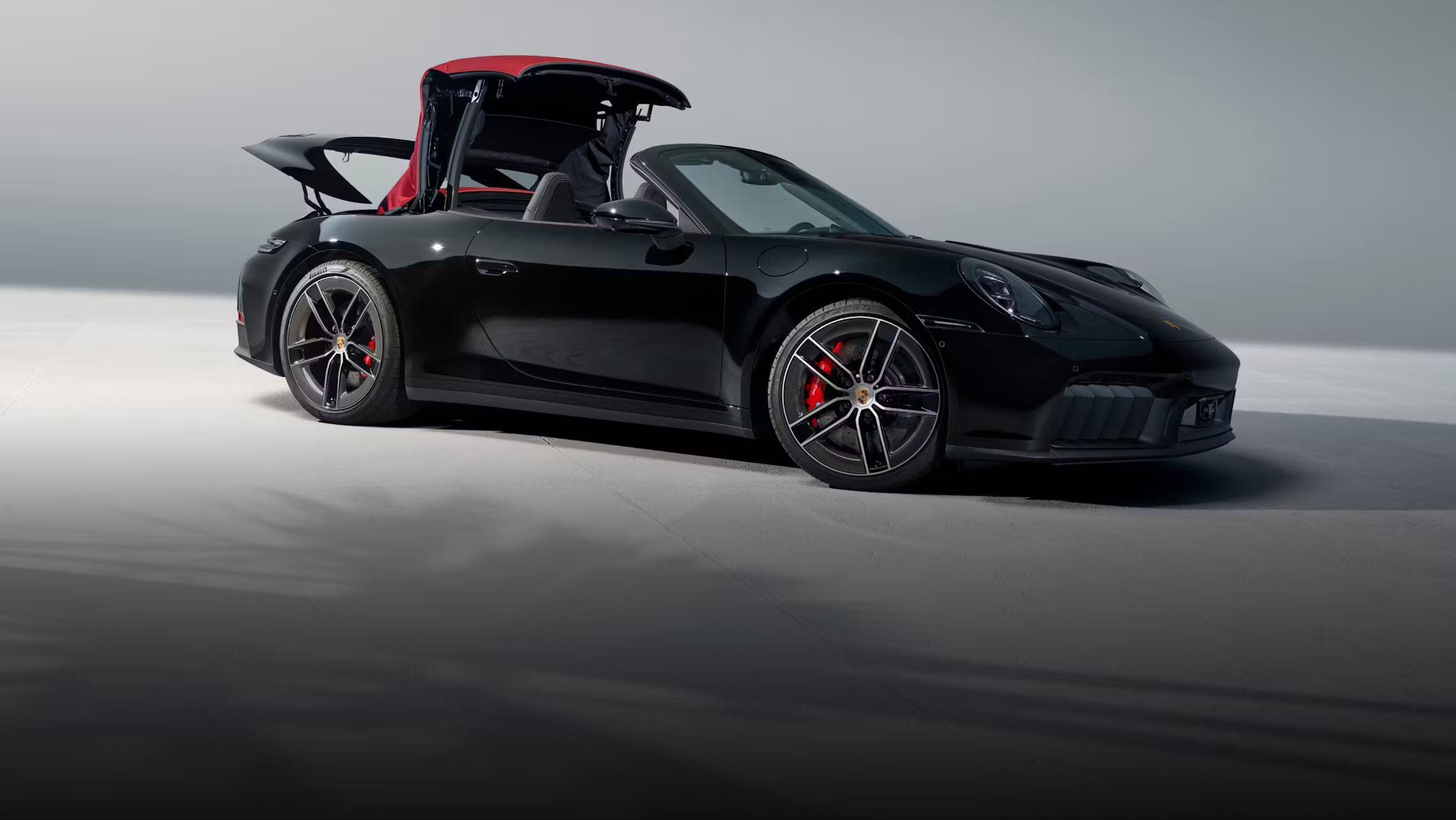 Porsche 911 parked in an urban Chicago setting, showcasing the appeal of Porsche Approved Certified Pre-Owned models.