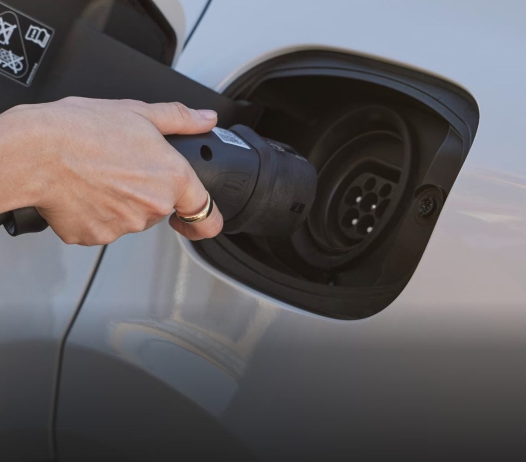 Porsche Cayenne electric flagship SUV charging, representing the future of the Cayenne and Porsche’s next-generation EV technology.