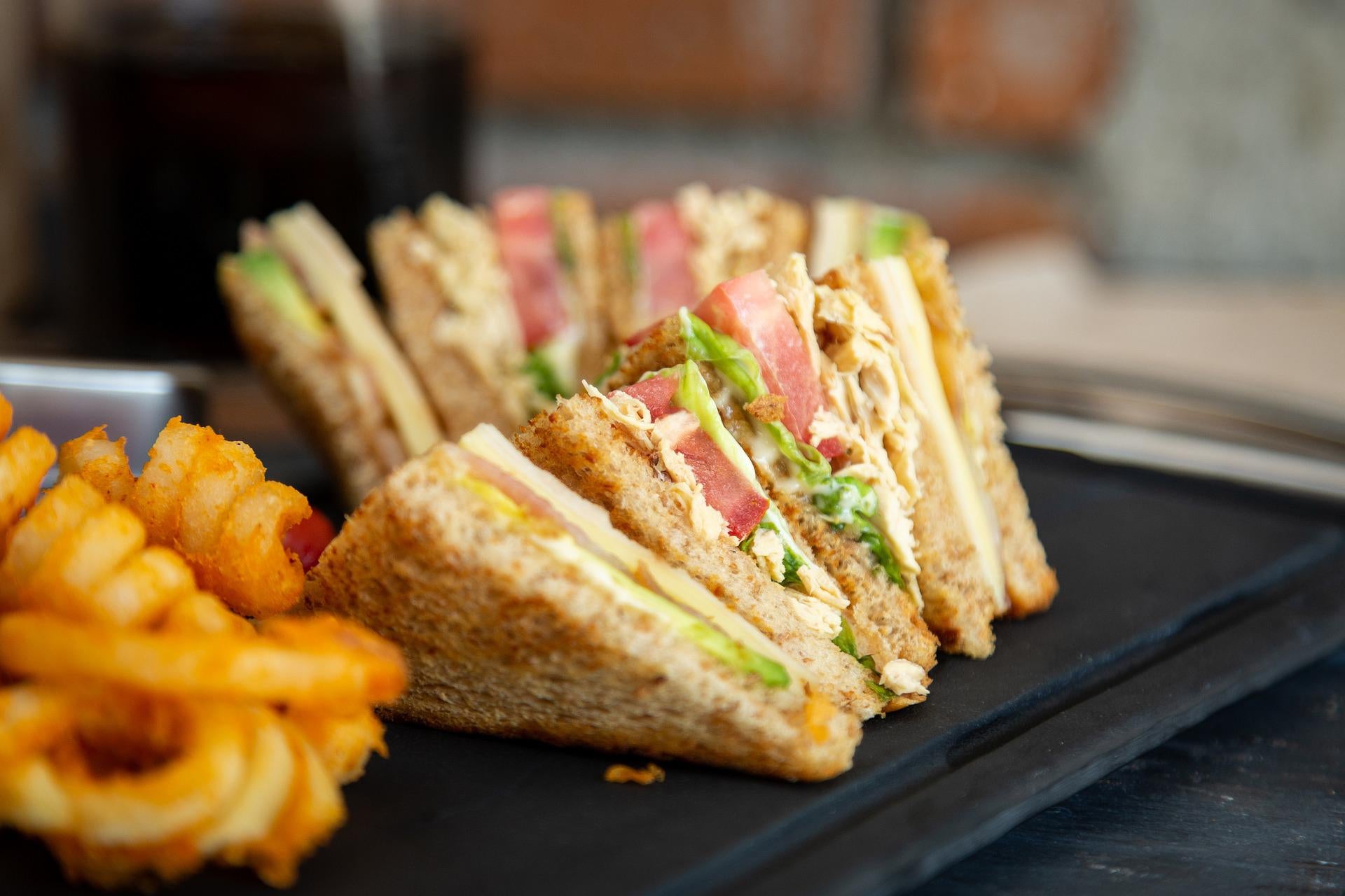 A sandwich and fries on a plate