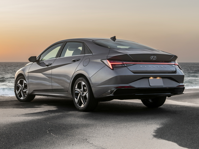 An Elantra Hybrid parked by the water at a beach
