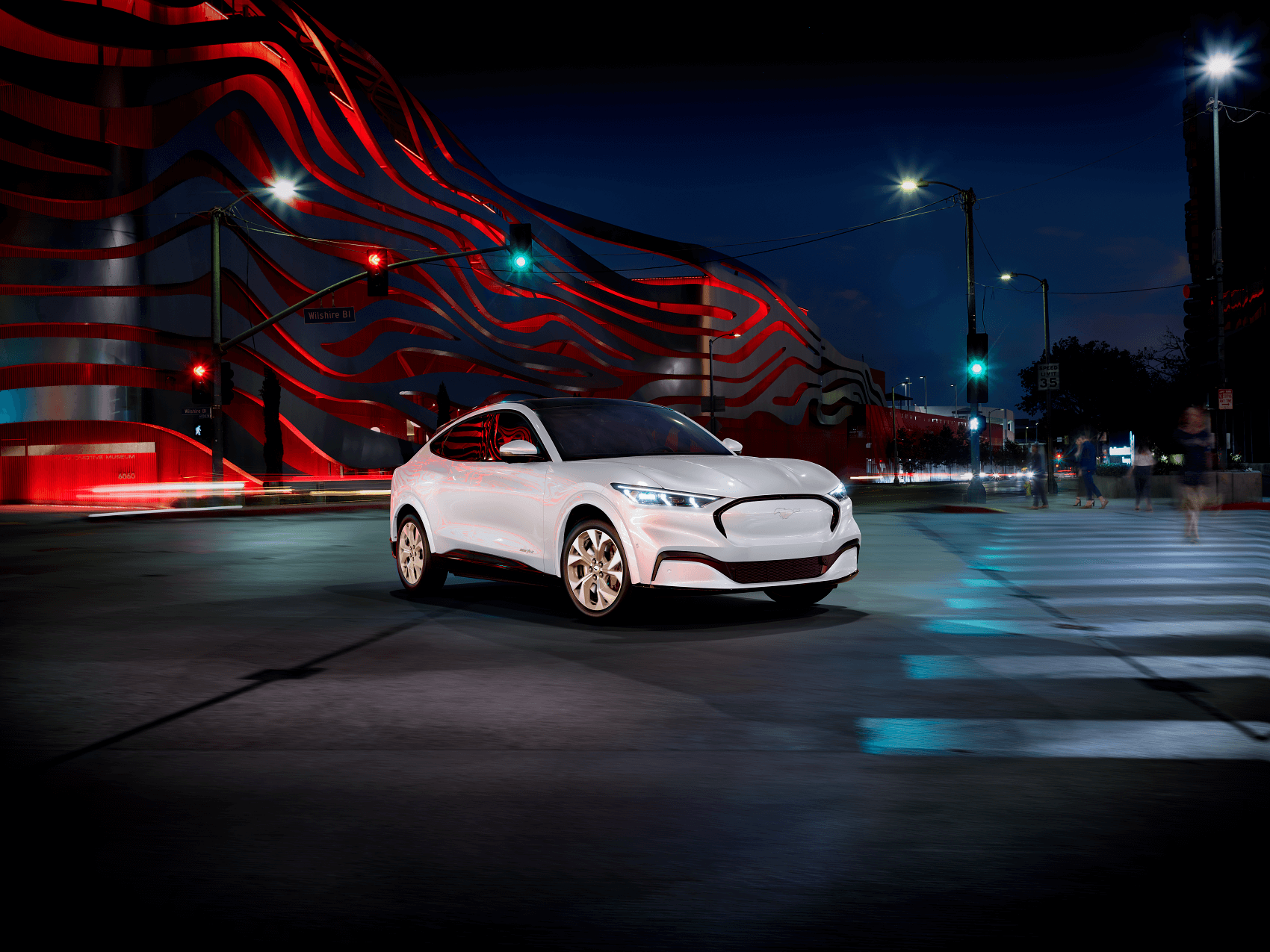 Ford Mustang Mach-E parked on the street at night - Ford Dealer near Woodbury MN