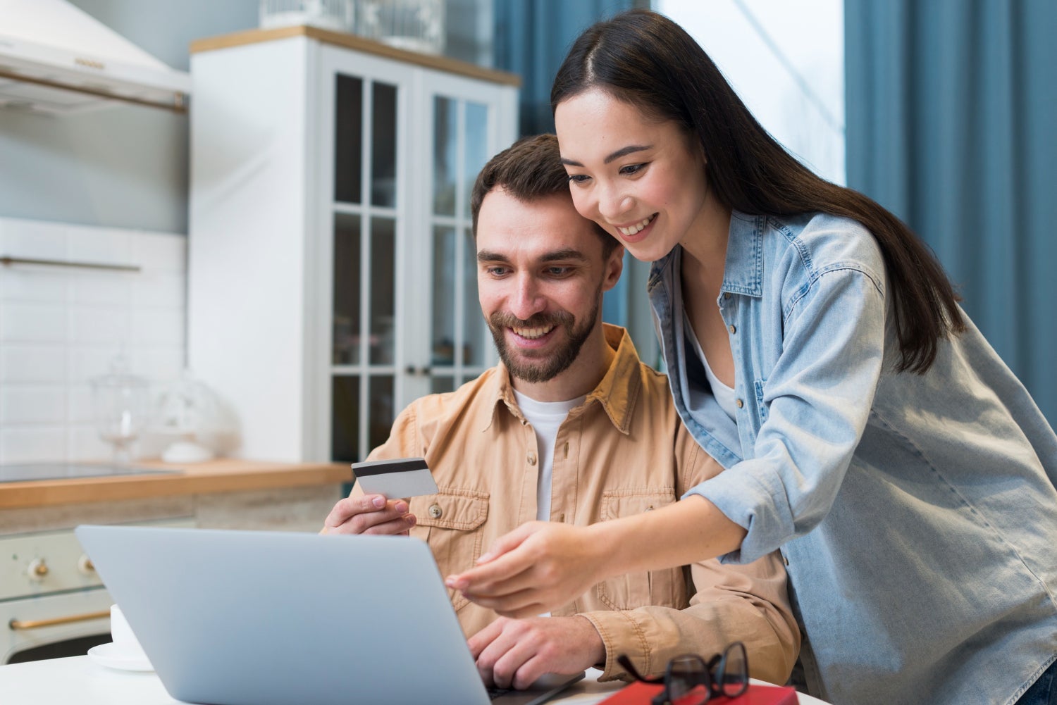 Couple looking at financing options for their next vehicle online