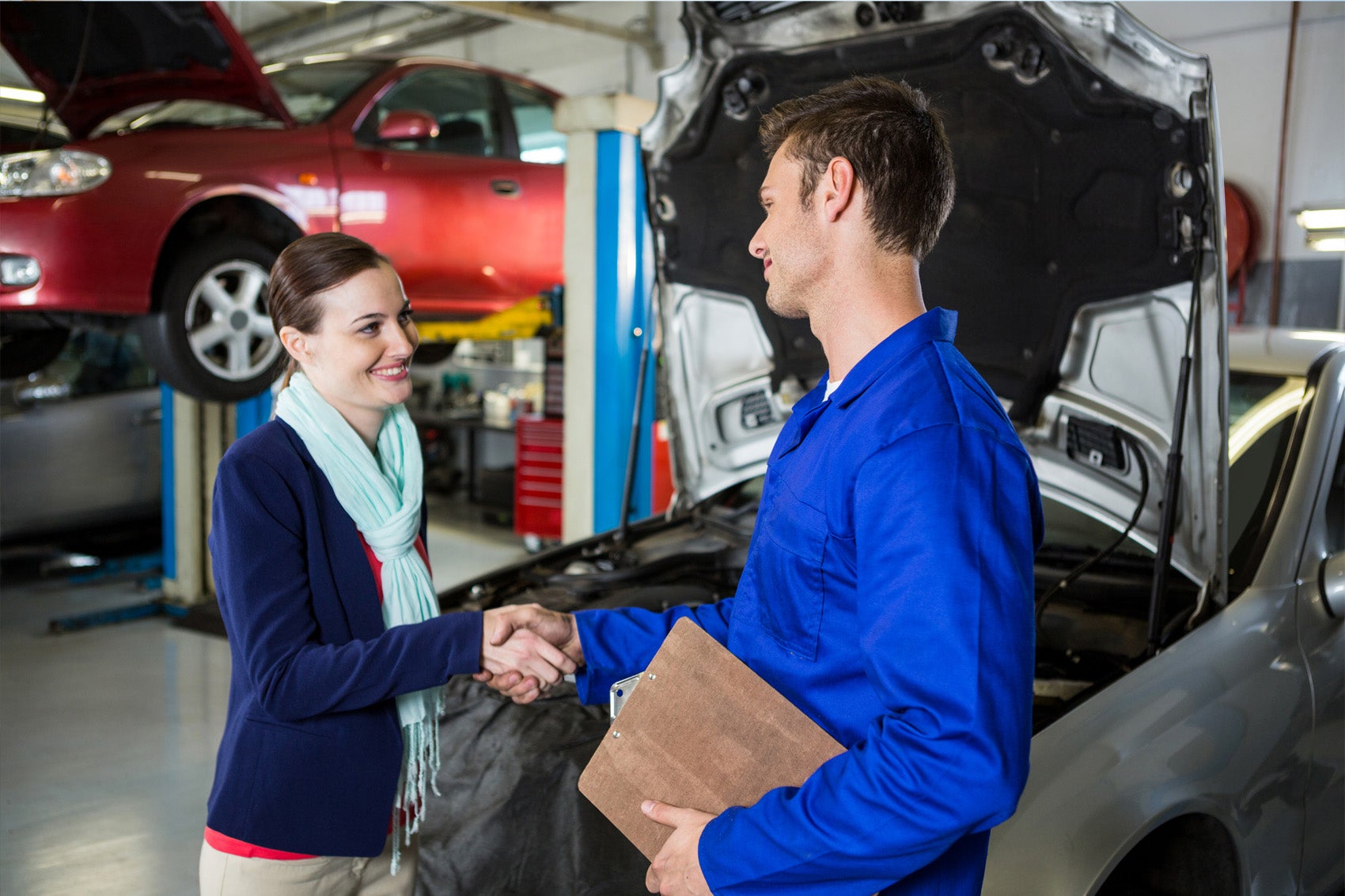 Woman shaking hand of Ford Certified Technician of the Service center at Inver Grove Ford