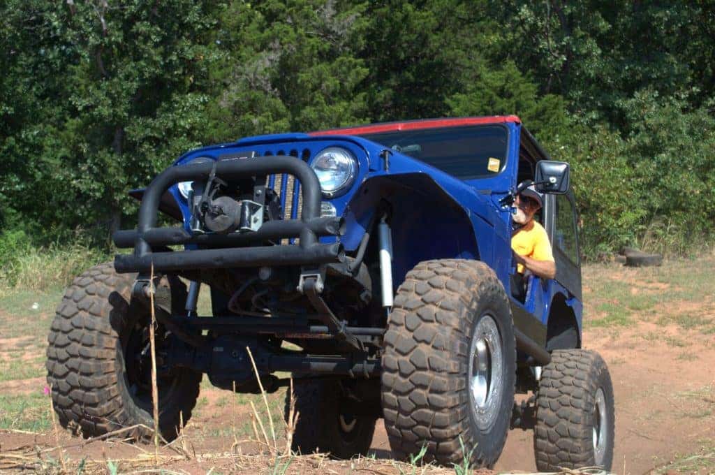 a blue jeep wrangler in Guthrie, Oklahoma ascending a hill