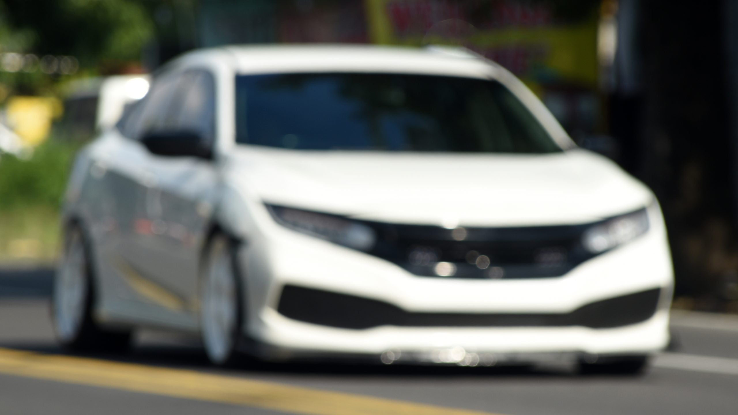 Blur,Abstract,Background,Of,A,White,Sport,Sedan