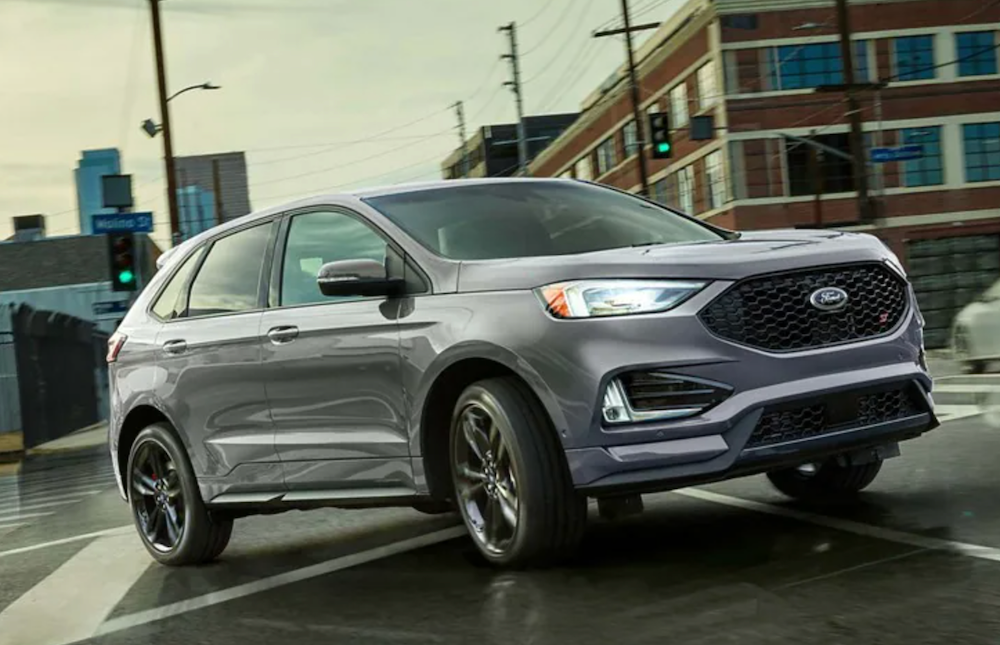 2023 Ford Edge driving on road showing front/right side view