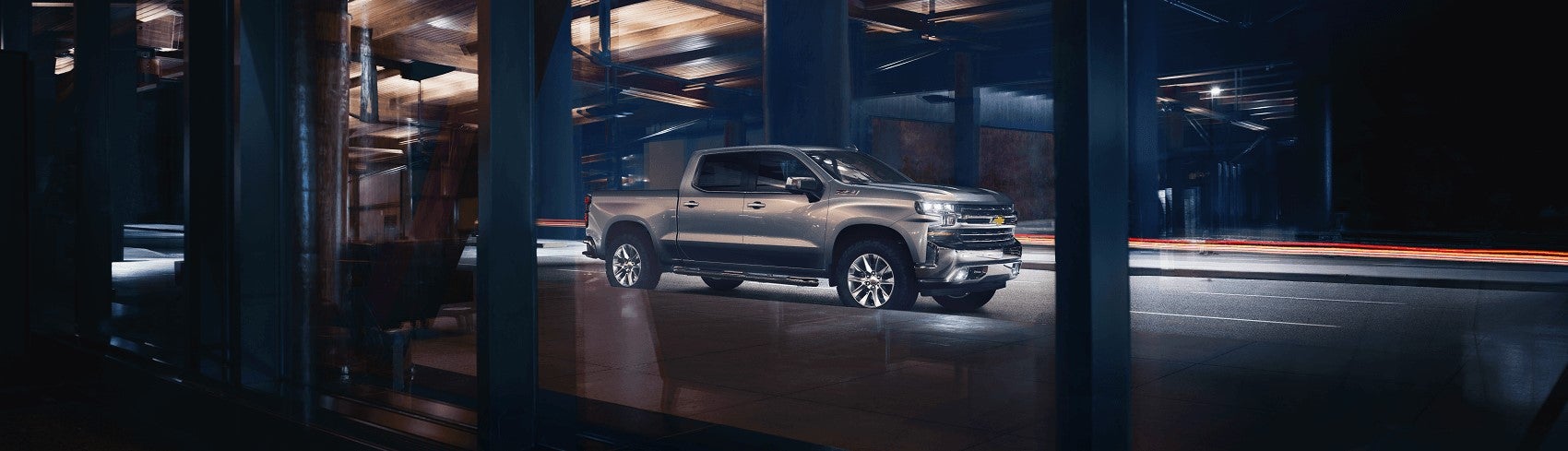 Silver Chevy Silverado 1500 vs Ford F-150 Worthington OH custom build