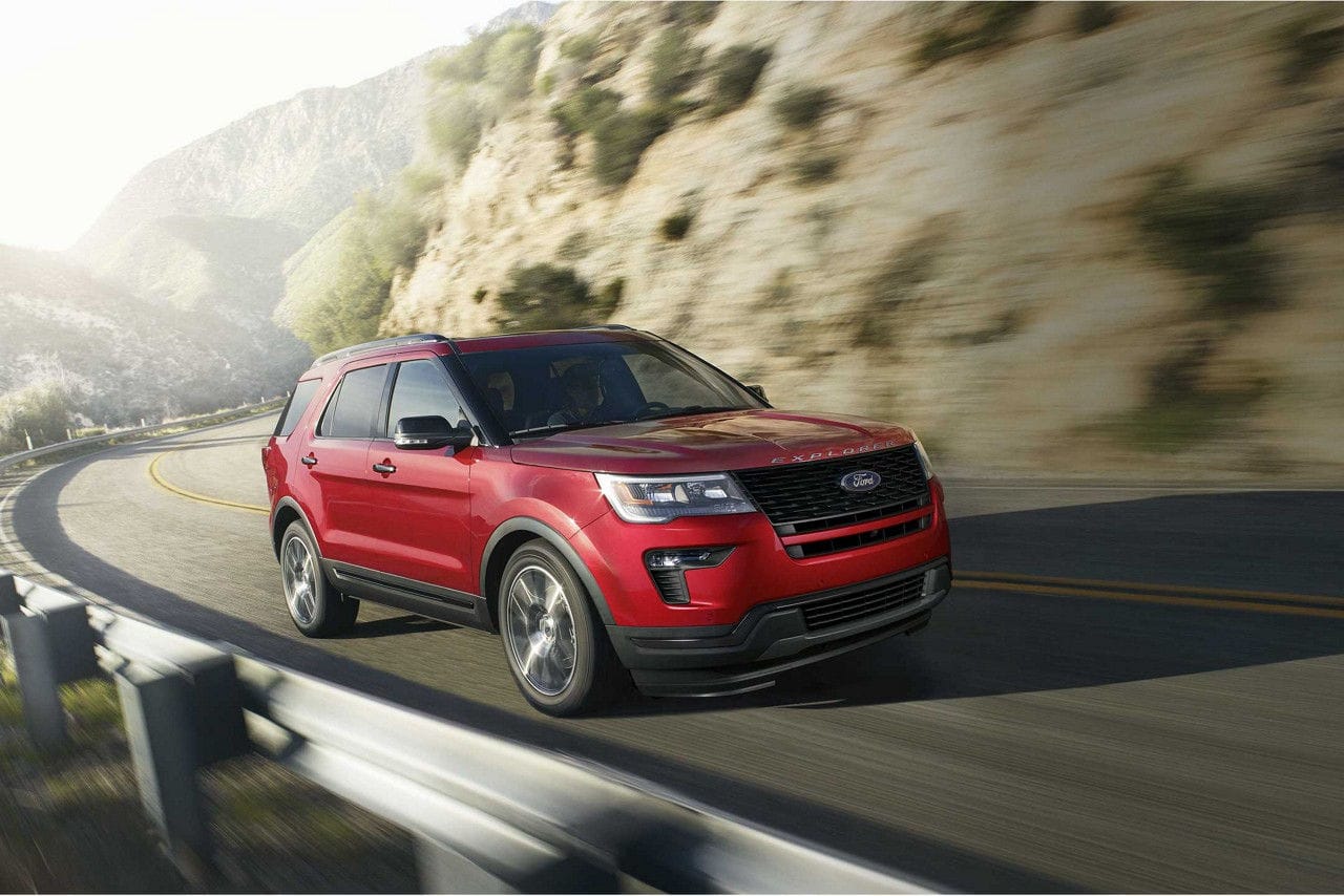 Image of a red 2019 Ford Escape driving on a highway.