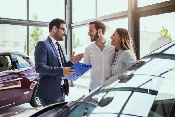 Customers in the dealership showroom