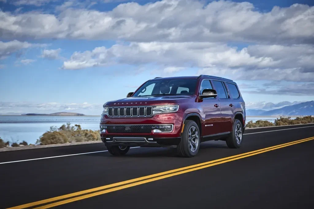 Jeep Wagoneer Driving on a Coastal Road Front 3/4 View