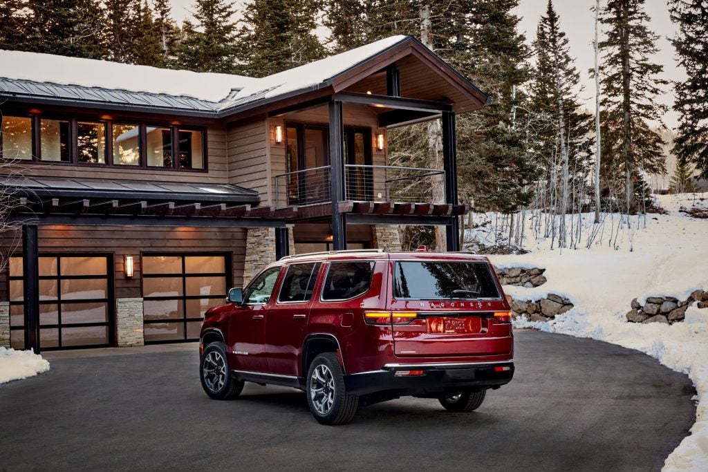 A Low-Cost Red 2025 Grand Wagoneer Parking Outside Its Holiday Home