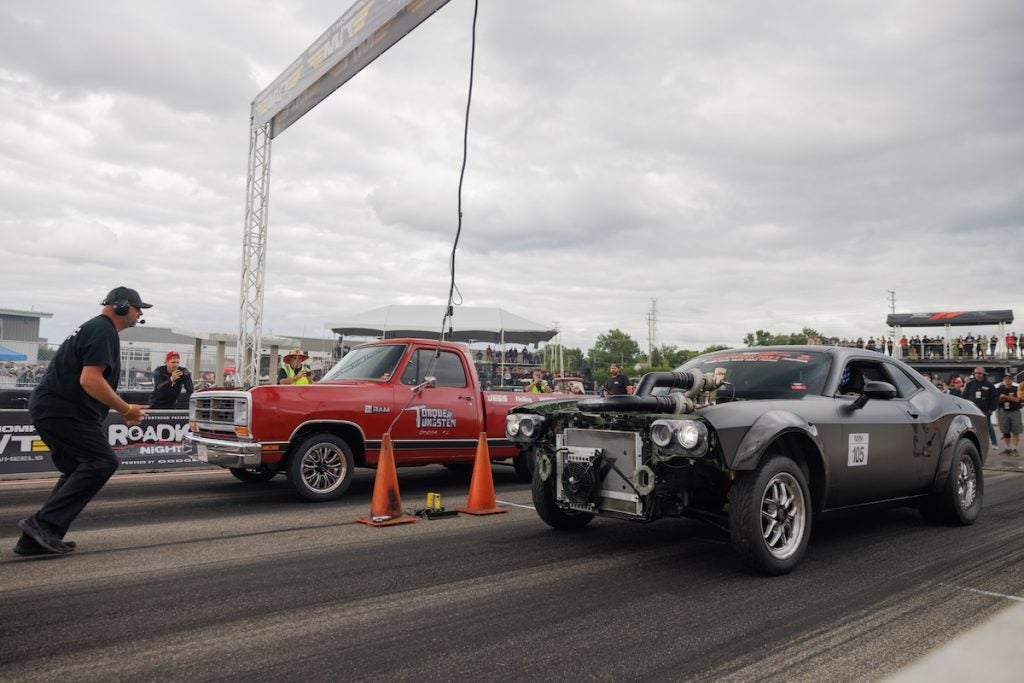 Morgan Evans (left lane) drove her Dodge D150 to victory against Garrett Reed in his Dodge Challenger SRT Demon in the final round of the Direct Connection Grudge Race during the Roadkill Nights Powered by Dodge event. All Grudge Race competitors used Direct Connection HurriCrate engines in their build projects.