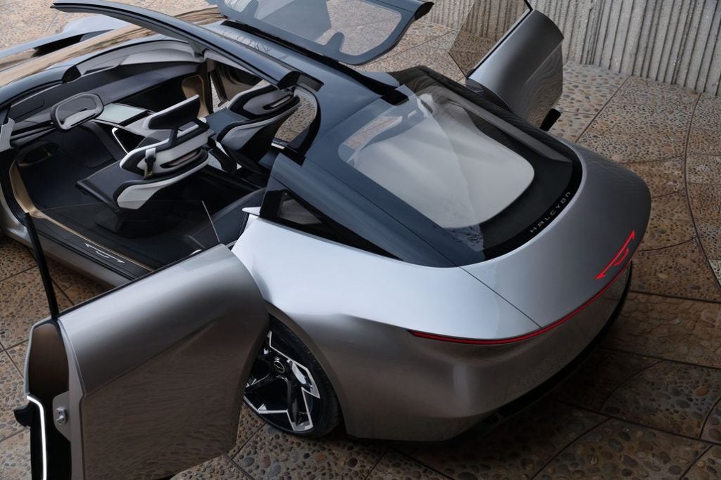A warm Acrylic-tinted butterfly-hinged canopy serves as a third door for the Chrysler Halcyon Concept and works in conjunction with the red–carpet style side doors to offer spacious ingress and egress.