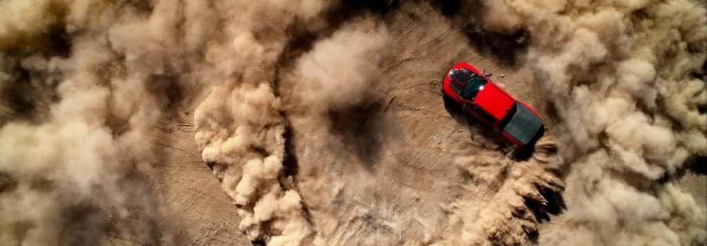 2023 Ram TRX driving circles in dirt field