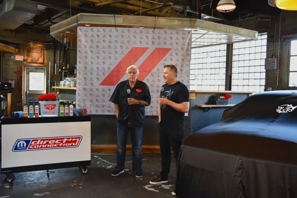 Jay Leno With a Dodge Charger in His Garage