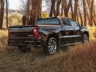 A black Chevy Silverado parked outside