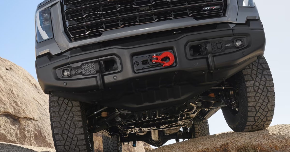 GMC truck undercarriage climbing over rocks and off-roading