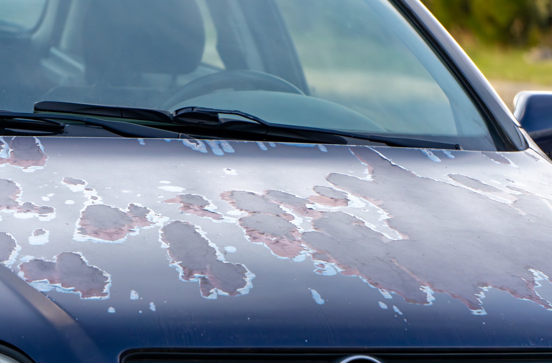 Car with paint peeling on the hood