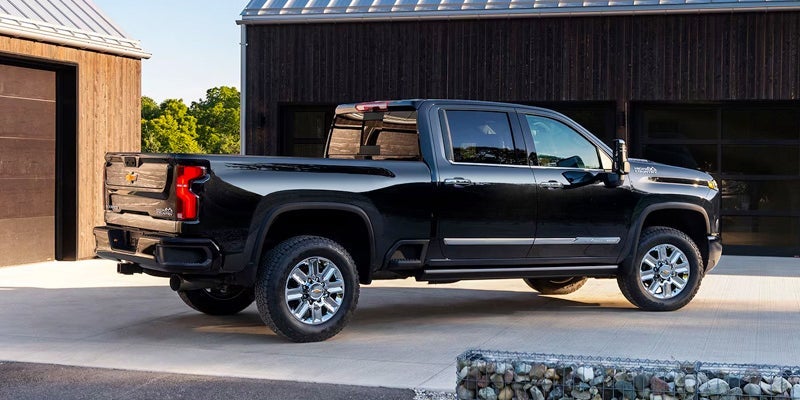 A photo of a parked black Chevy Silverado 1500