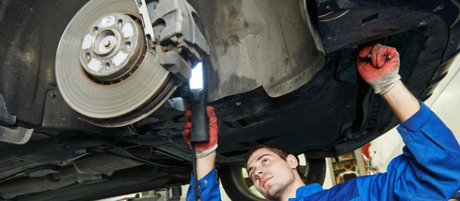 Vehicle receiving service inside a professional dealership service center