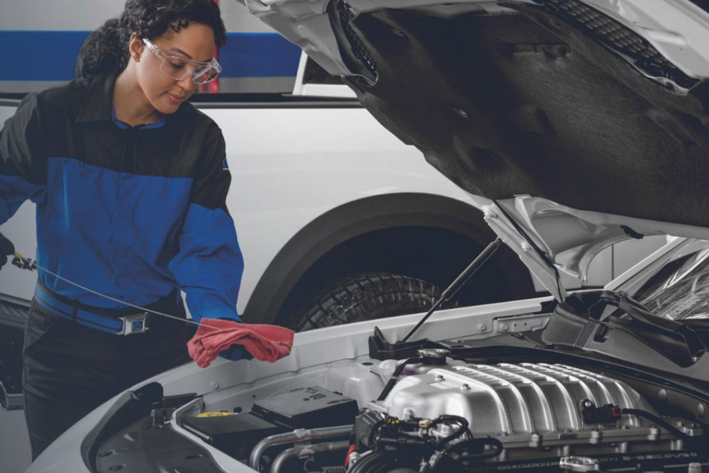 Technician performing an oil change