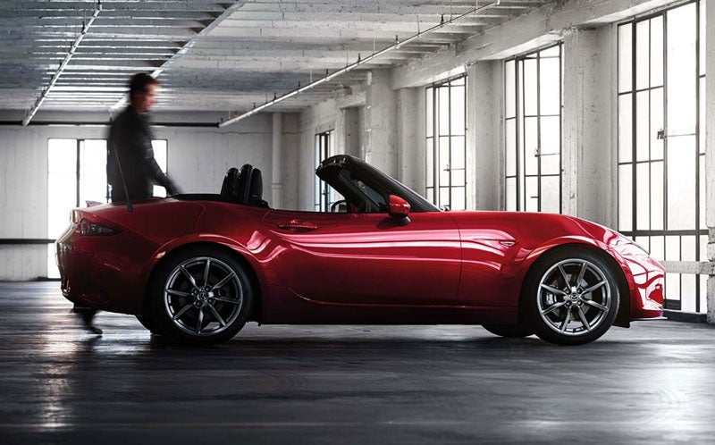 Mazda MX-5 Miata shown in profile, highlighting the long hood and short rear deck proportions