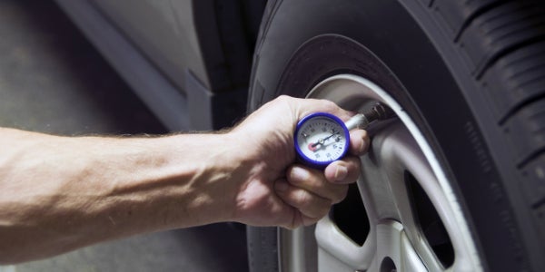 Checking tire pressure to help improve fuel economy