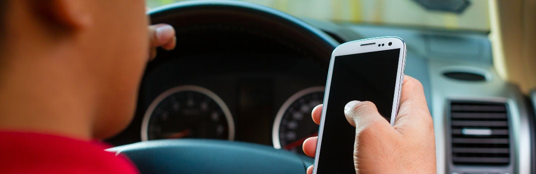 Mazda owner connecting their phone to their car to enable Android Auto
