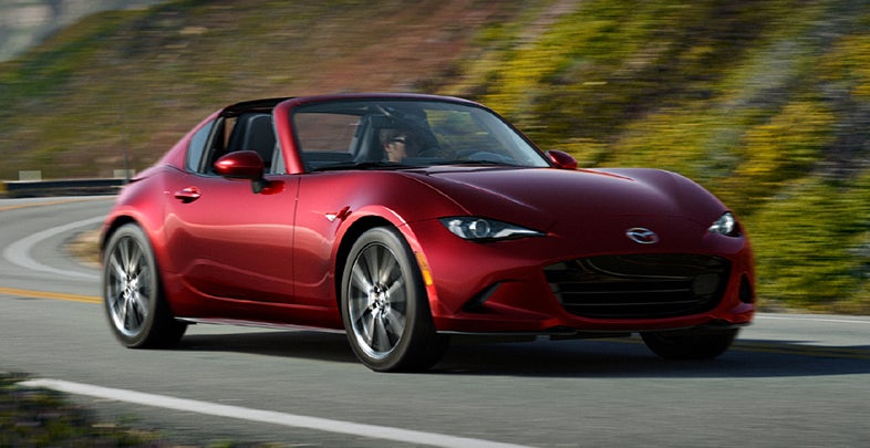 Red Mazda MX-5 Miata RF retractable fastback with the roof panel retracted