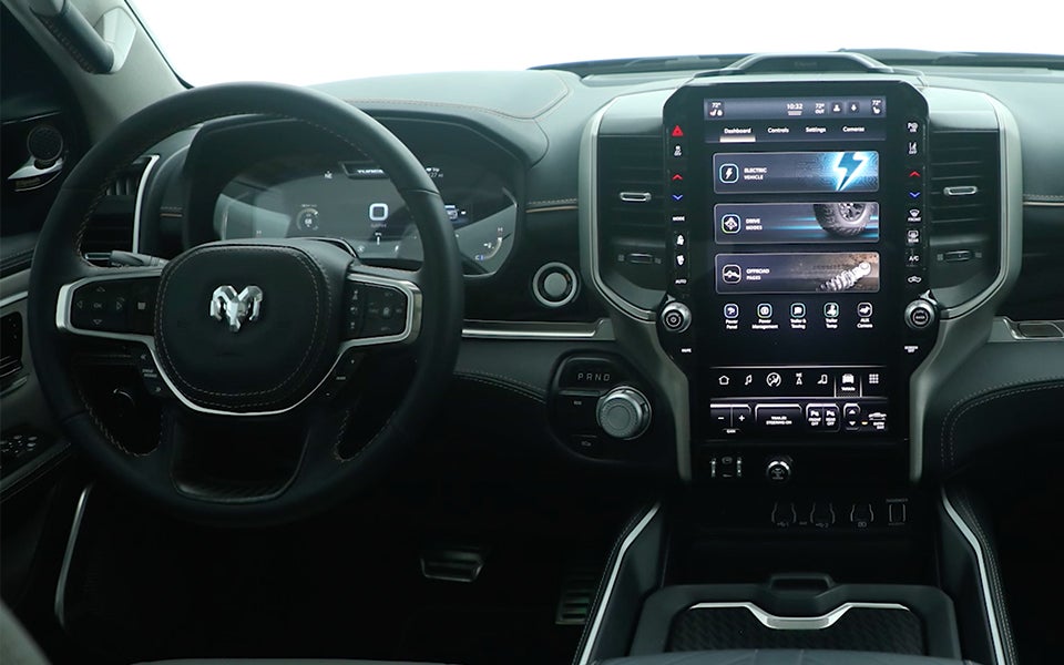 Black interior of the RAM 1500 REV electric truck.