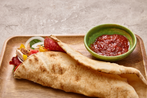 Soft taco and a side of salsa