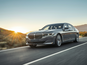 Gray BMW driving down highway