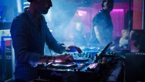 Silhouette of DJ in a night club