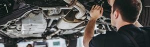 Service specialist working on car