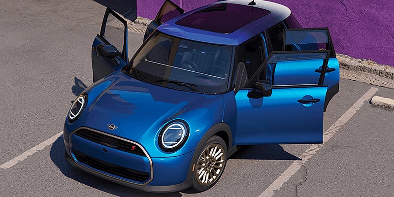 Overhead view of a 2025 MINI Cooper 4 door hard top in blue with all four doors open featured in Jacksonville, FL